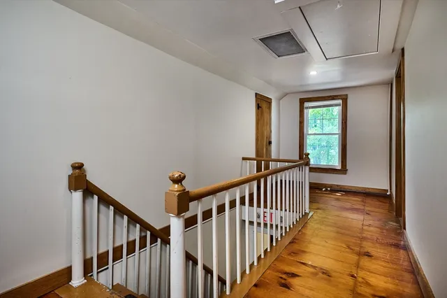 a view of a hallway with windows