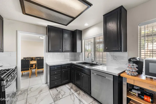 a kitchen with a sink and cabinets