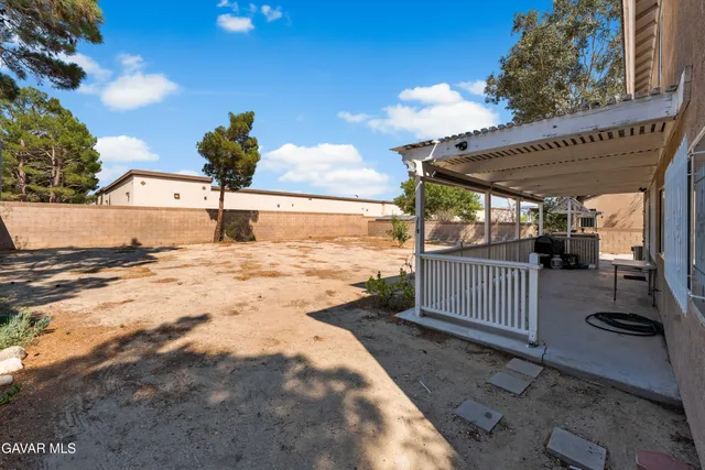 a view of a backyard of the house