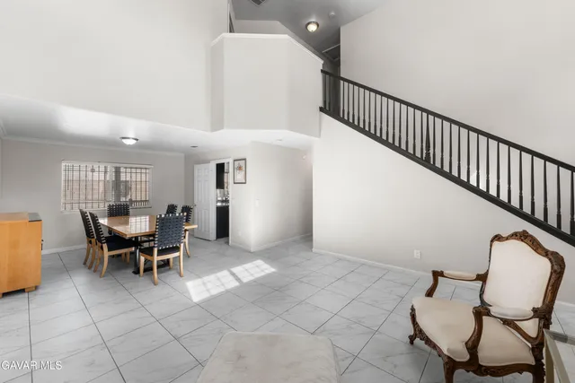 a view of a livingroom with furniture and white walls