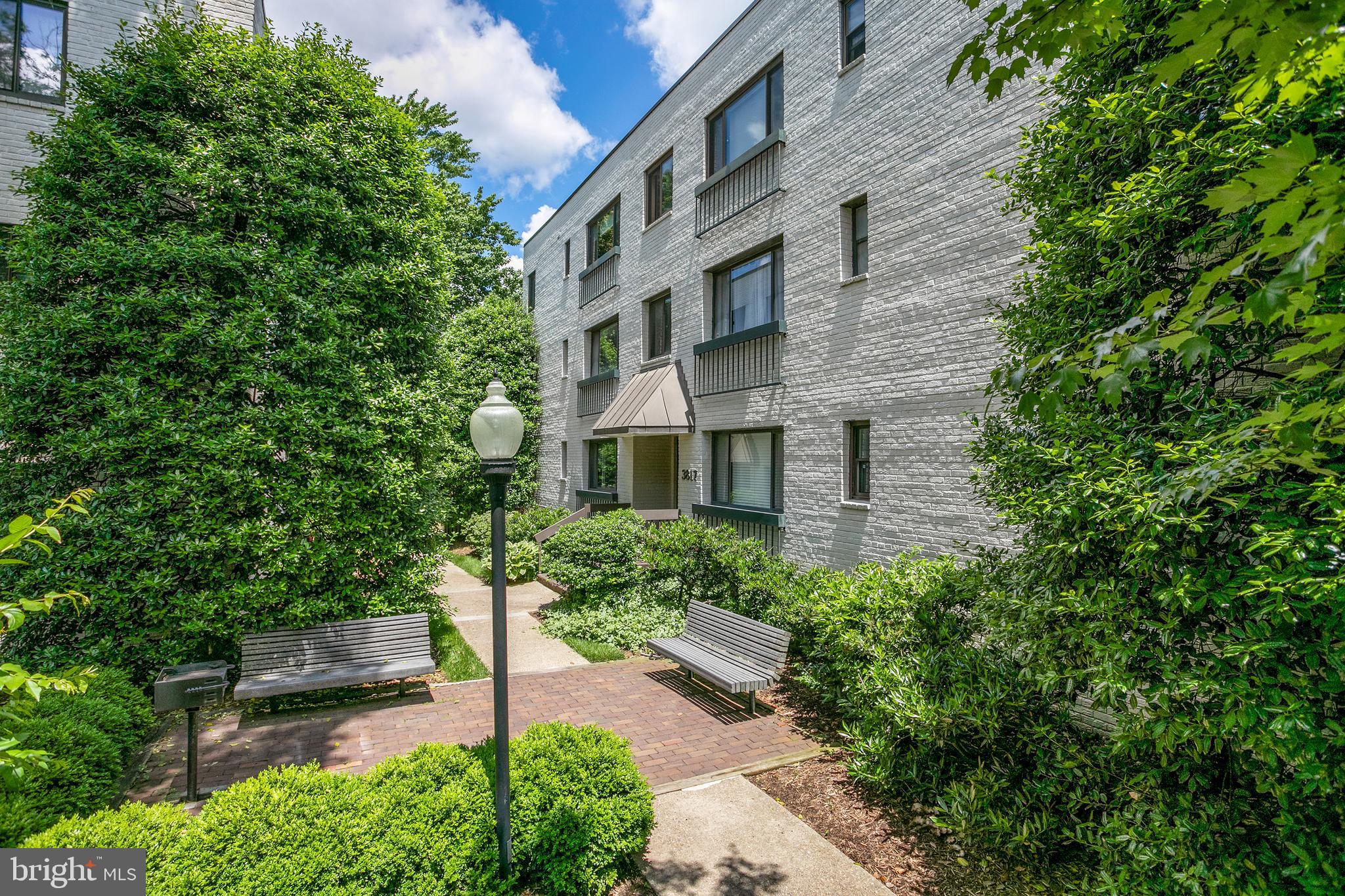 3817 Davis Place Northwest, Unit 2 Washington, DC 20007 - Photo 15 of 21 a brick building with a tree in front of it