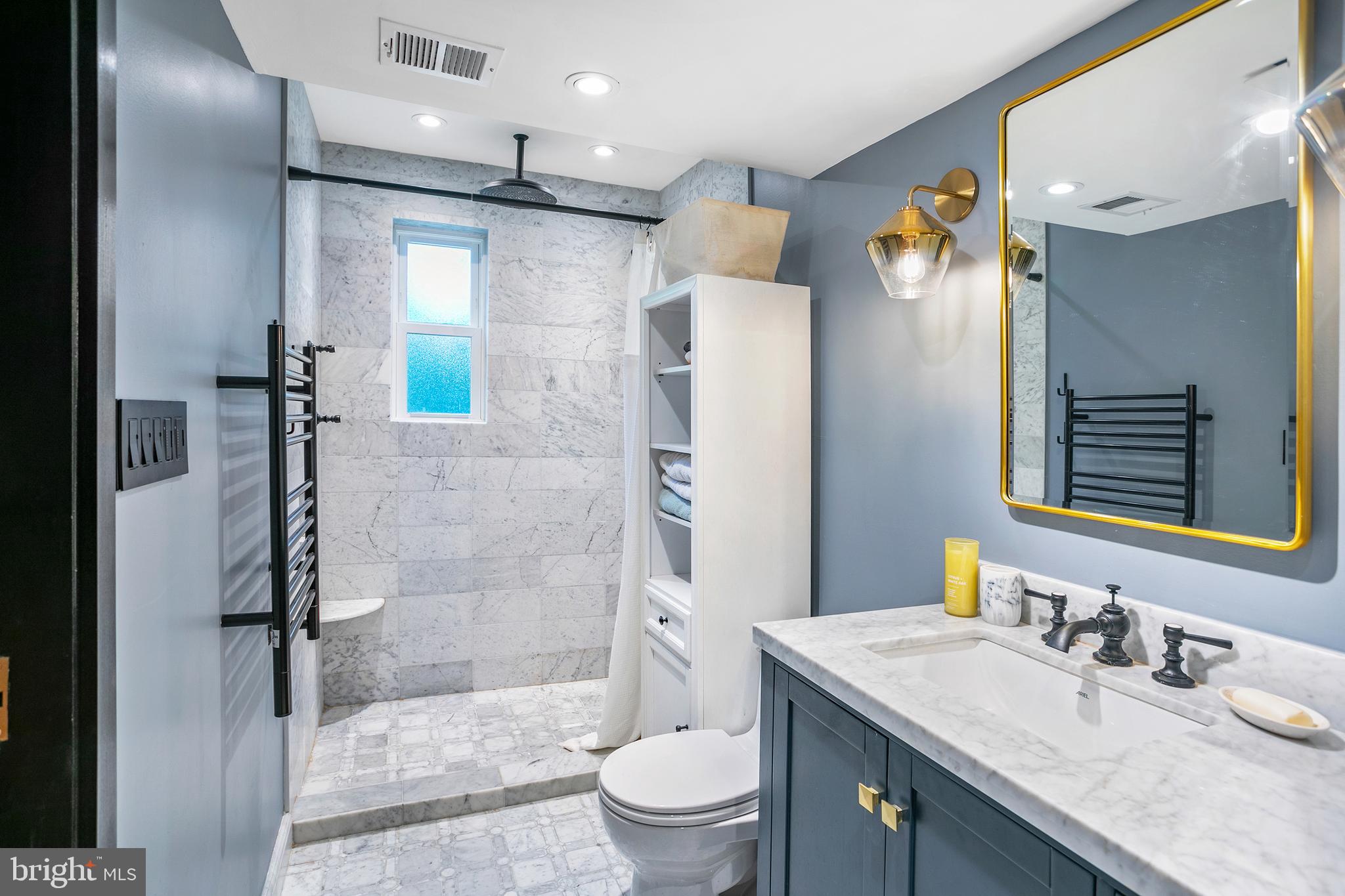 3817 Davis Place Northwest, Unit 2 Washington, DC 20007 - Photo 6 of 21 a bathroom with a granite countertop sink toilet and shower
