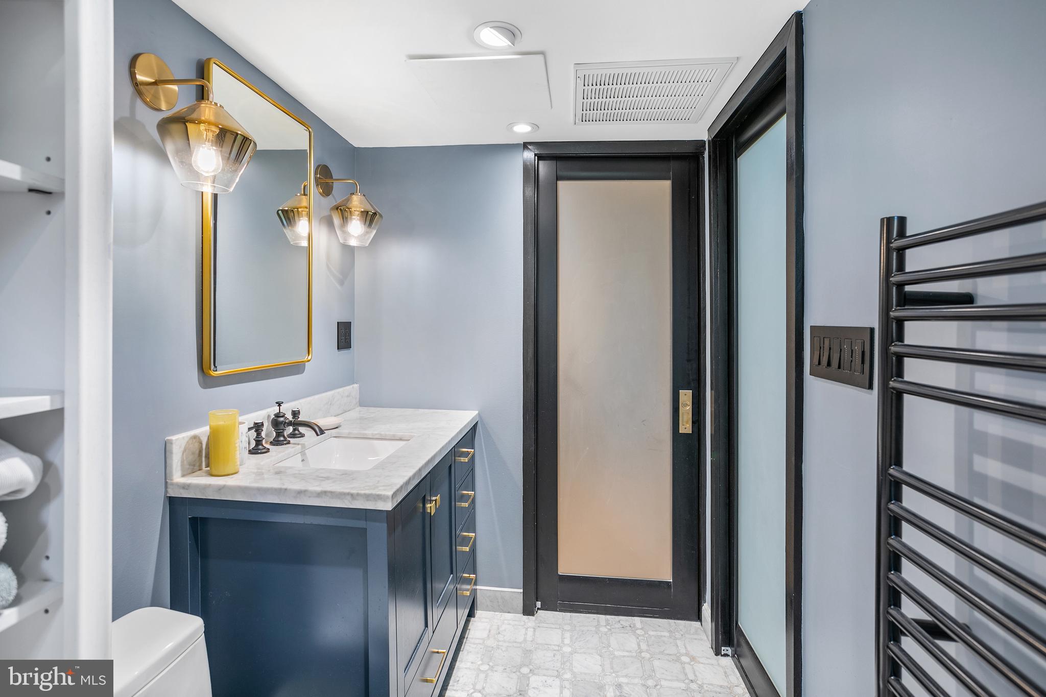 3817 Davis Place Northwest, Unit 2 Washington, DC 20007 - Photo 7 of 21 a bathroom with a sink and a mirror