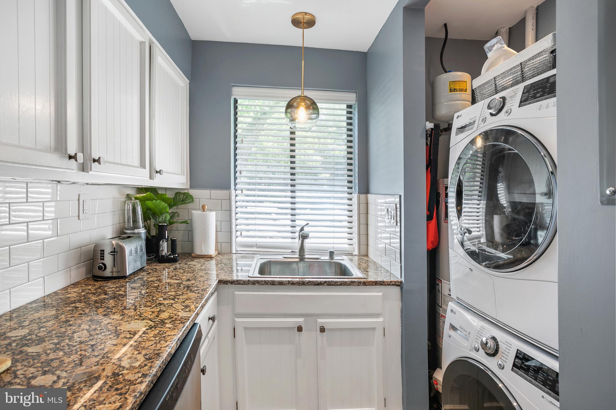 3817 Davis Place Northwest, Unit 2 Washington, DC 20007 - Photo 10 of 21 a view of a kitchen with washer and dryer