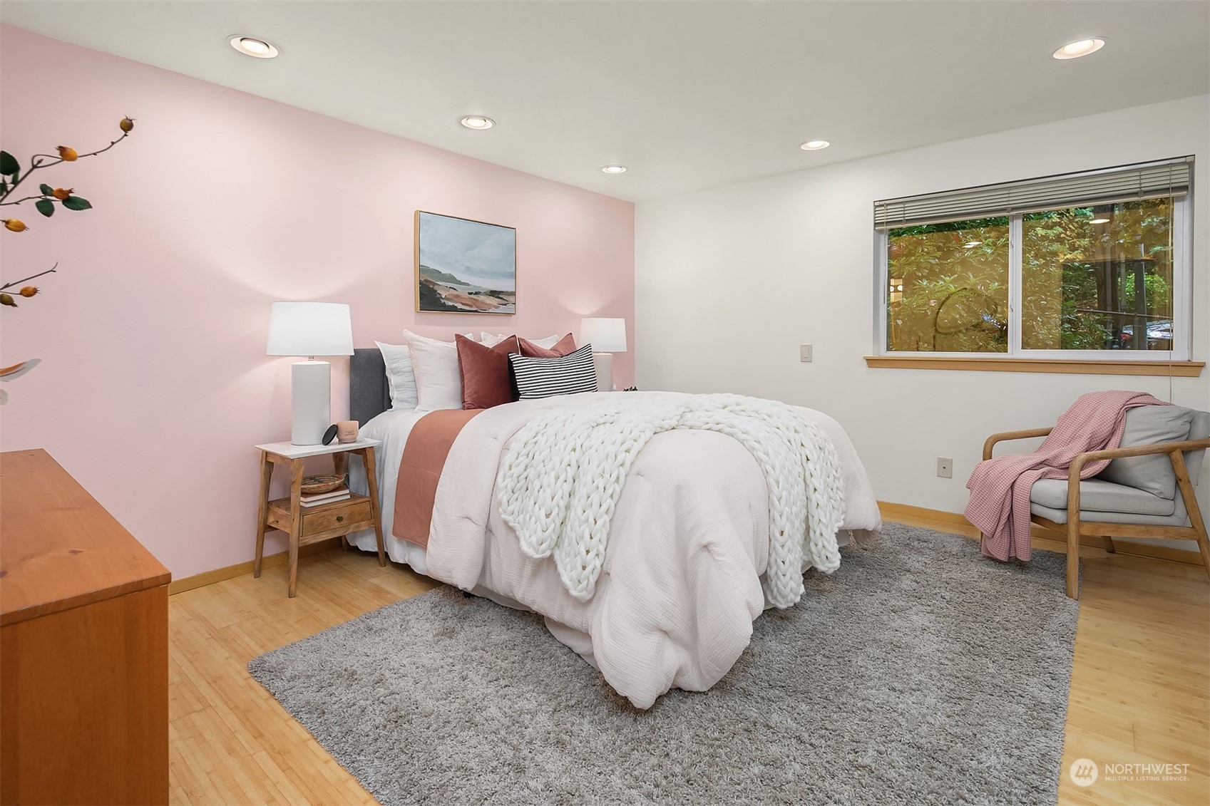 1110 West Howe Street, Unit 202 Seattle, WA 98119 - Photo 11 of 15 a spacious bedroom with a bed and window