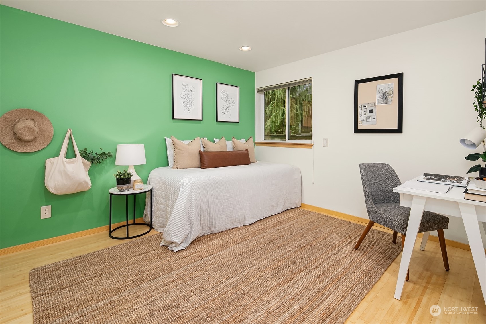 1110 West Howe Street, Unit 202 Seattle, WA 98119 - Photo 13 of 15 a bedroom with a bed and a table