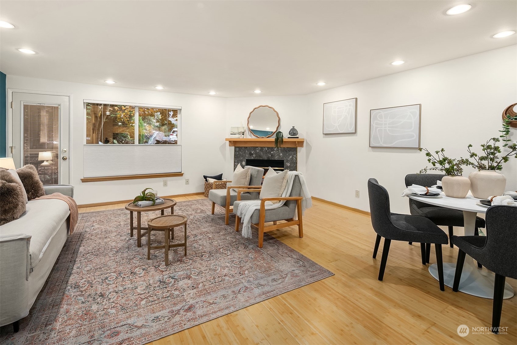 1110 West Howe Street, Unit 202 Seattle, WA 98119 - Photo 3 of 15 a living room with furniture and a rug