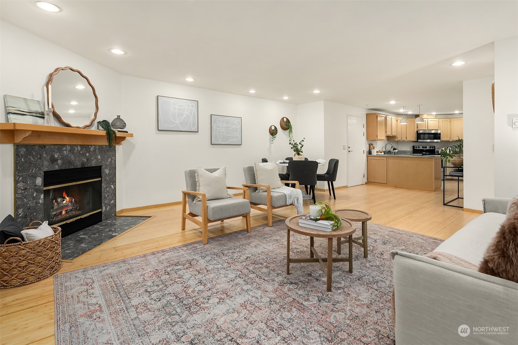 1110 West Howe Street, Unit 202 Seattle, WA 98119 - Photo 4 of 15 a living room with furniture and a fireplace