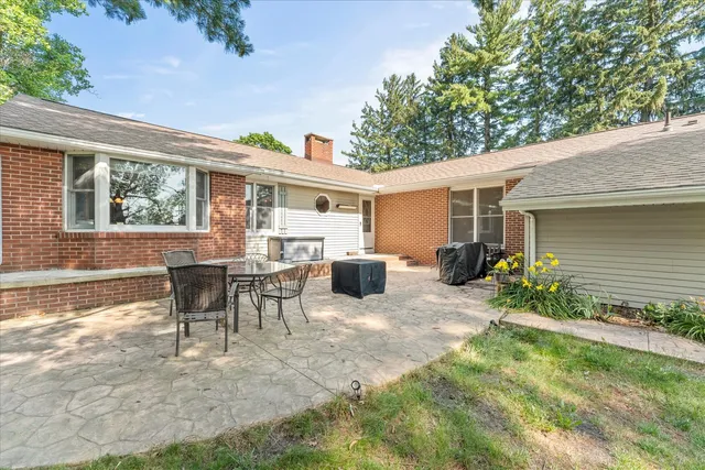a view of a table and chairs in the garden
