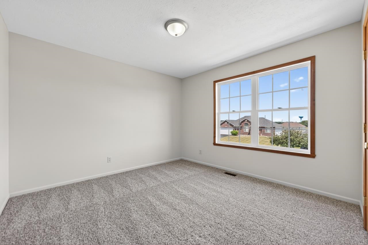 676 Elberon Way Roscoe, IL 61073 - Photo 27 of 30 an empty room with windows
