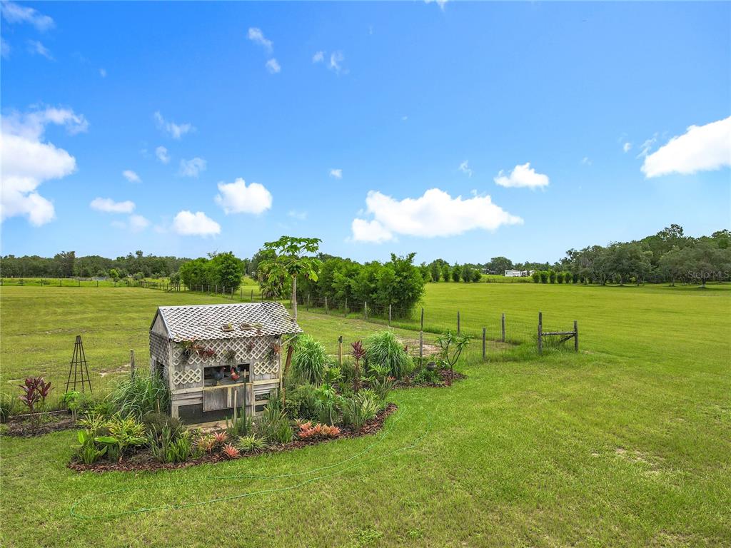 10220 Bay Lake Road Groveland, FL 34736 - Photo 65 of 67 a view of a lake with houses in the back