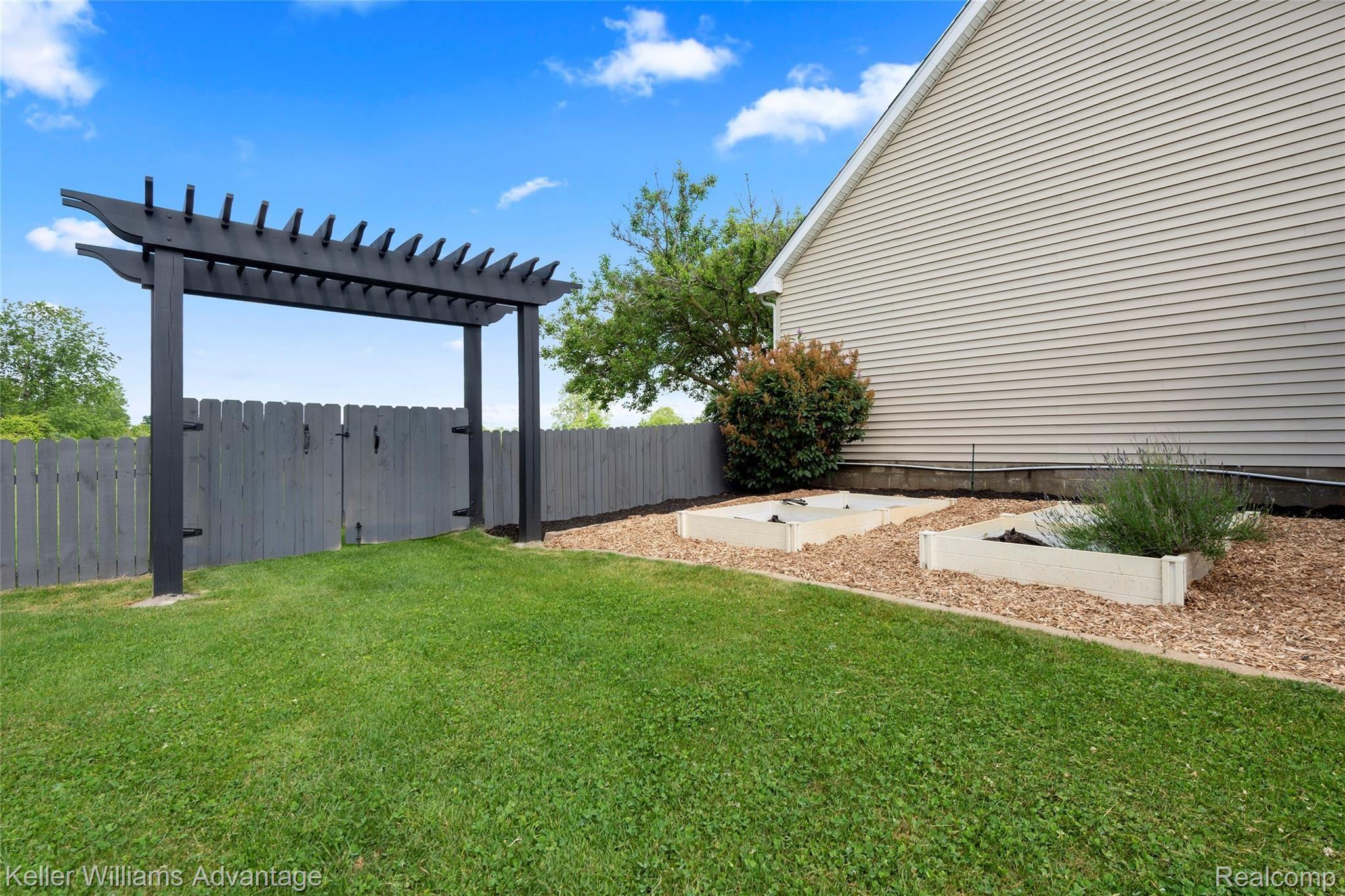 6347 Oak Grove Road Howell, MI 48855 - Photo 31 of 49 Garden area with Pergola