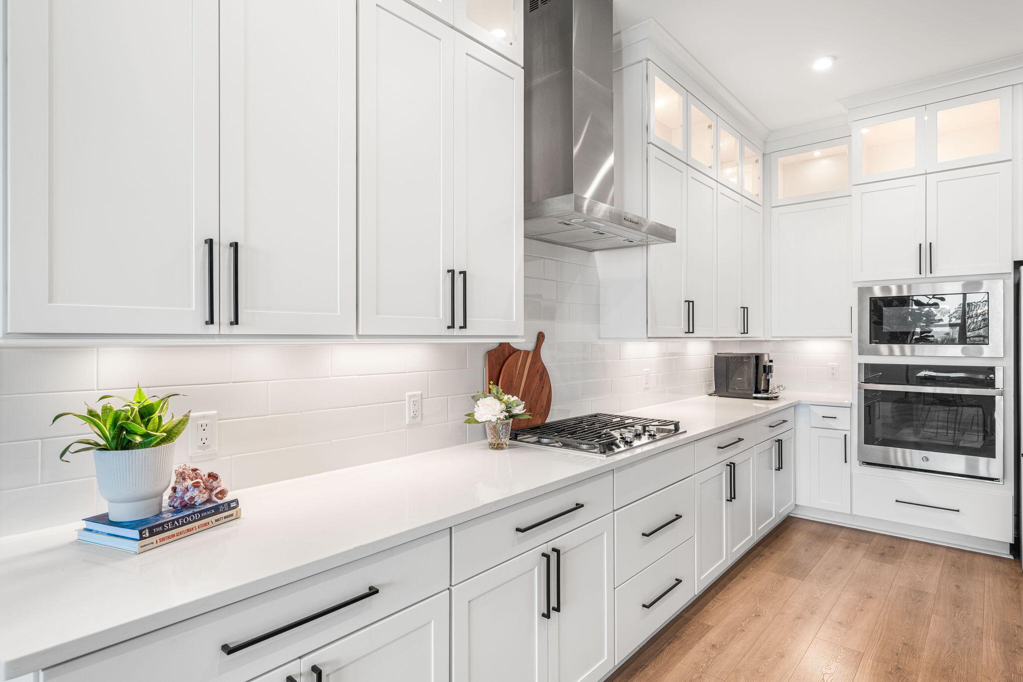 425 Lafayette Road Watersound, FL 32461 - Photo 4 of 47 a kitchen with stainless steel appliances white cabinets and a stove