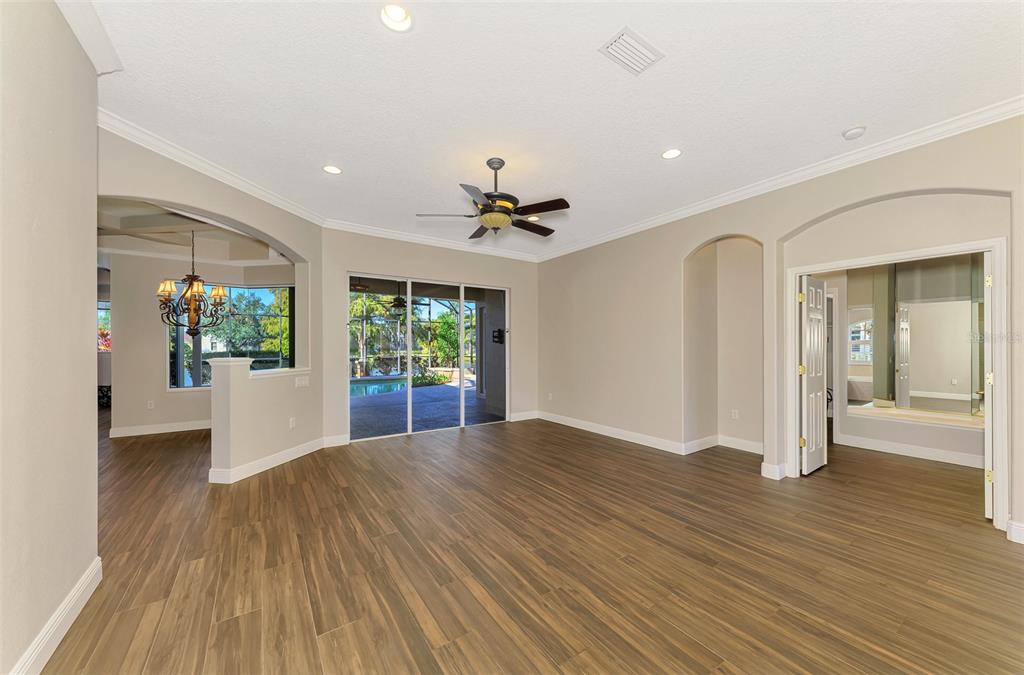 6610 Coopers Hawk Court Lakewood Ranch, FL 34202 - Photo 18 of 97 a view of livingroom with hardwood floor and a ceiling fan