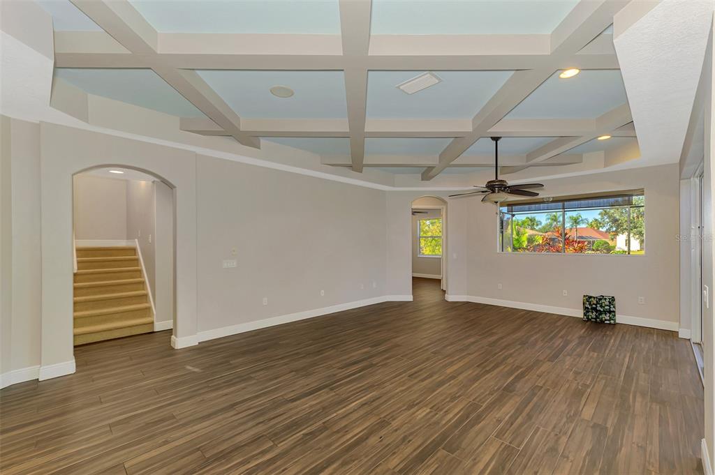6610 Coopers Hawk Court Lakewood Ranch, FL 34202 - Photo 26 of 97 a view of a hallway with wooden floor