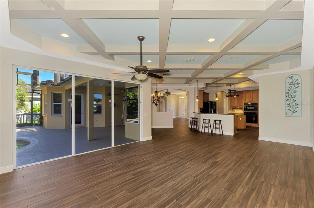 6610 Coopers Hawk Court Lakewood Ranch, FL 34202 - Photo 29 of 97 a view of a big room with wooden floor