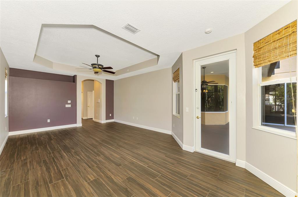 6610 Coopers Hawk Court Lakewood Ranch, FL 34202 - Photo 41 of 97 a view of a livingroom with a ceiling fan and window
