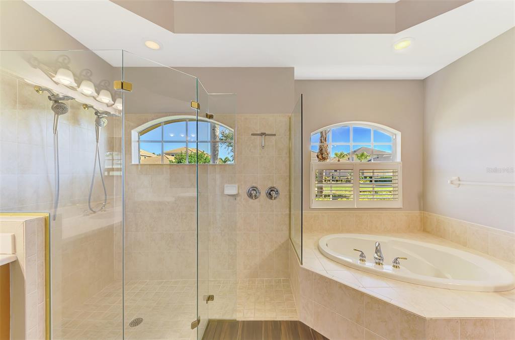 6610 Coopers Hawk Court Lakewood Ranch, FL 34202 - Photo 47 of 97 a bathroom with a tub a sink and a shower