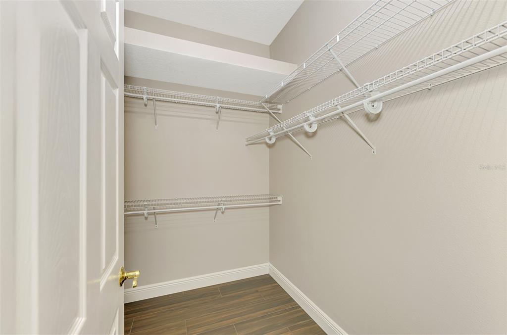 6610 Coopers Hawk Court Lakewood Ranch, FL 34202 - Photo 49 of 97 a view of an empty walk in closet