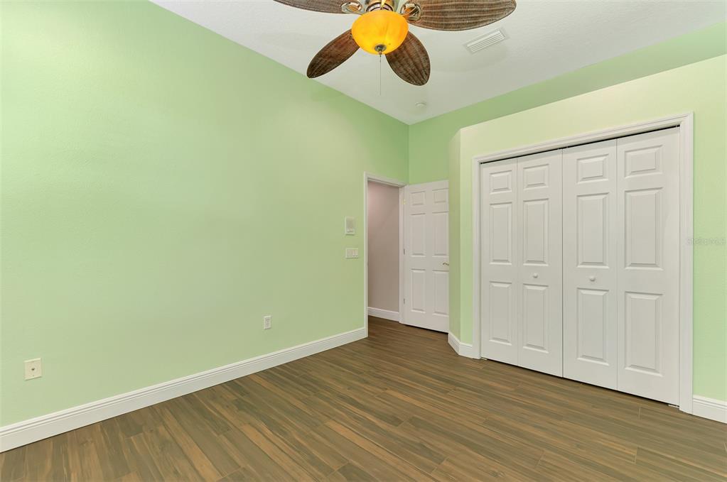6610 Coopers Hawk Court Lakewood Ranch, FL 34202 - Photo 51 of 97 a view of a room with wooden floor