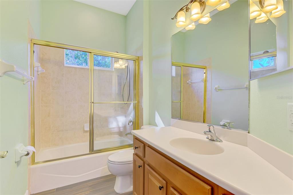 6610 Coopers Hawk Court Lakewood Ranch, FL 34202 - Photo 52 of 97 a bathroom with a sink toilet and shower