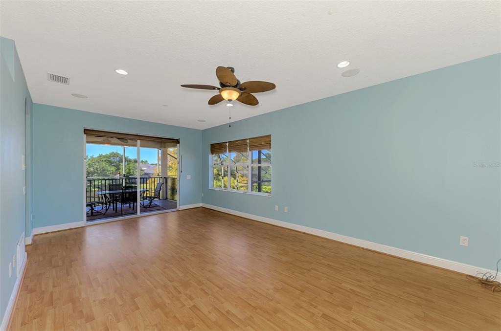 6610 Coopers Hawk Court Lakewood Ranch, FL 34202 - Photo 58 of 97 wooden floor in an empty room with a window