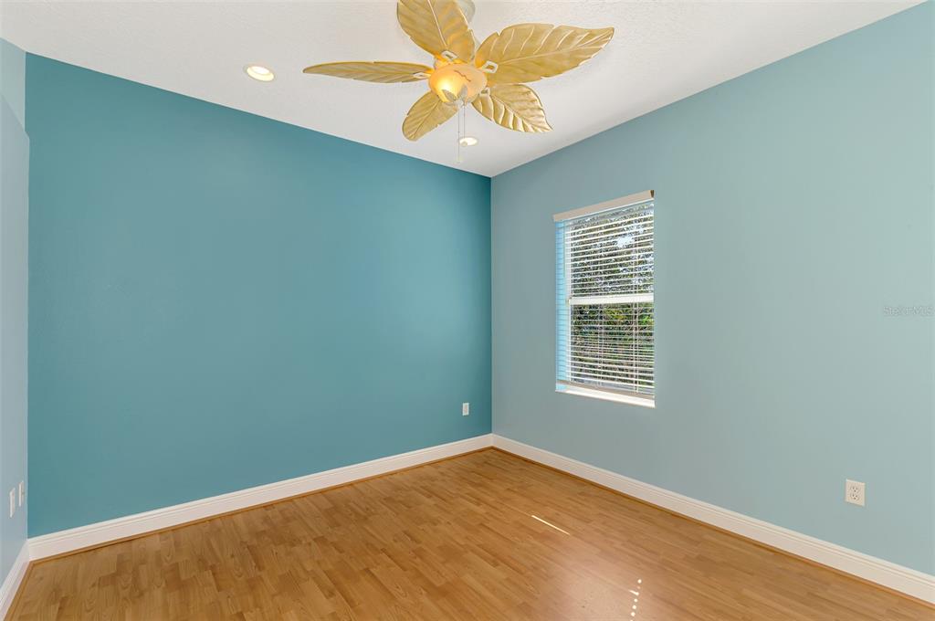 6610 Coopers Hawk Court Lakewood Ranch, FL 34202 - Photo 62 of 97 an empty room with a window and a fan