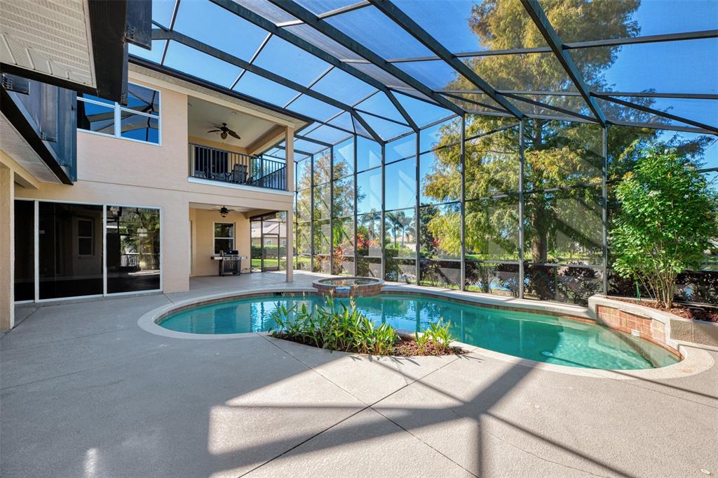 6610 Coopers Hawk Court Lakewood Ranch, FL 34202 - Photo 79 of 97 a view of a swimming pool with a patio