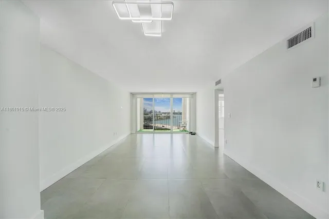 a kitchen with a sink cabinets and white countertops