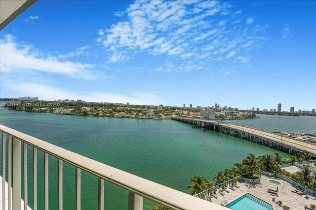a view of swimming pool from a balcony