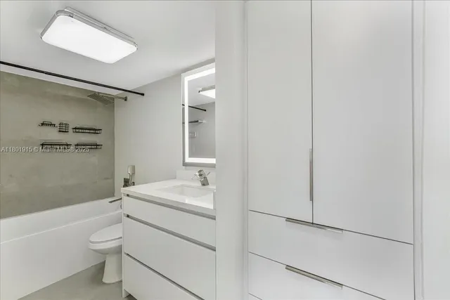 a view of multiple houses with a yard