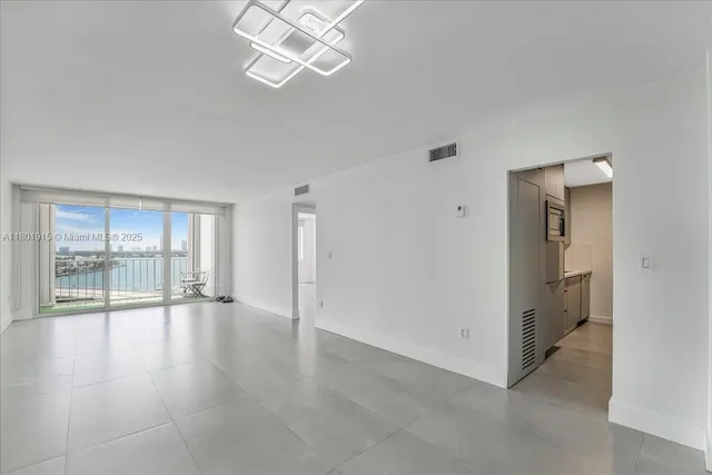 a front view of a building with a yard