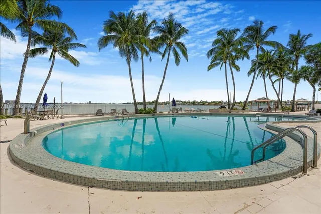 a view of swimming pool with outdoor seating