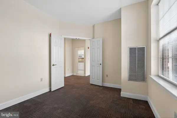 a view of empty room with windows