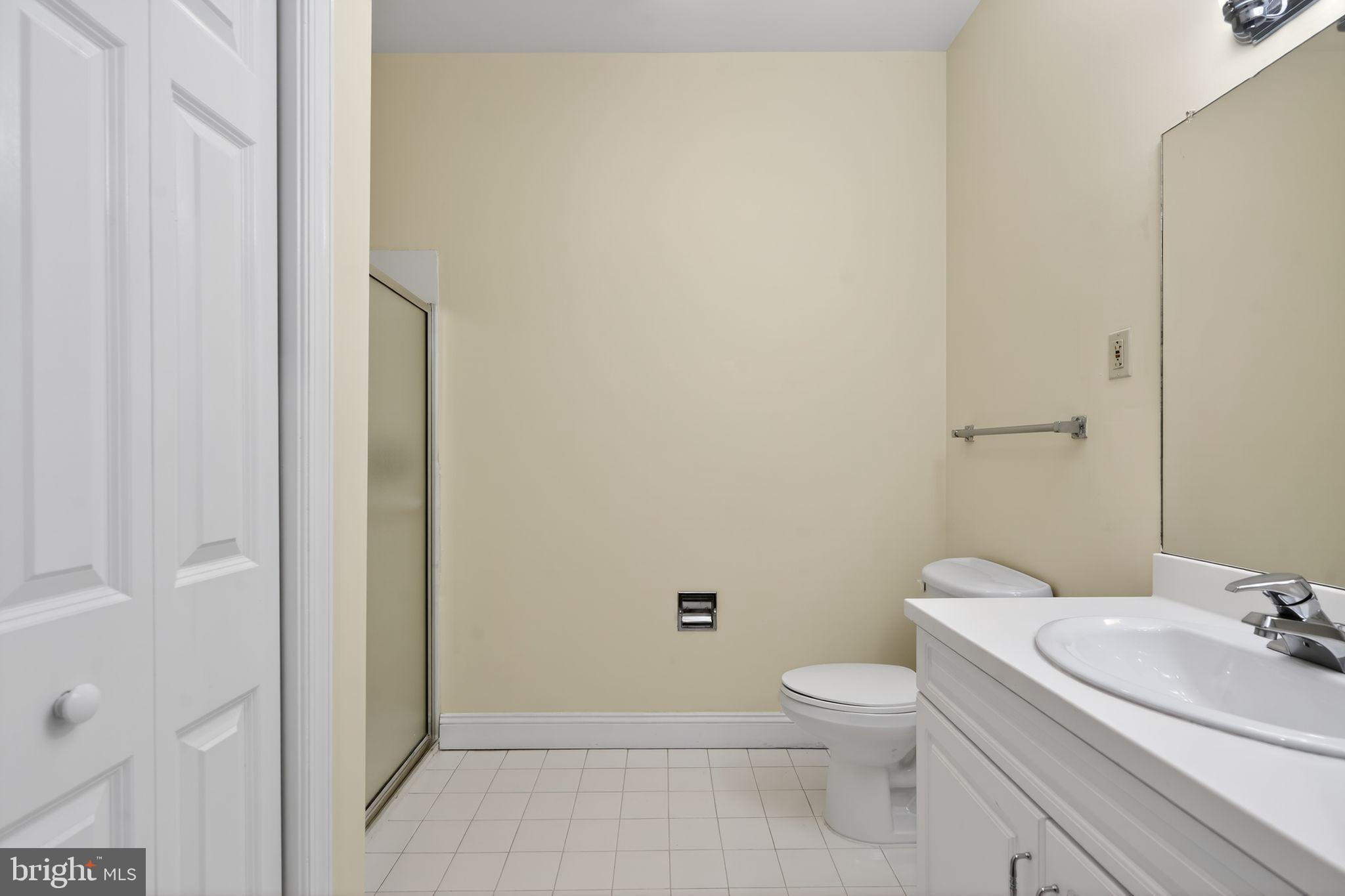 2006 Windrow Drive Princeton, NJ 08540 - Photo 17 of 23 a bathroom with a granite countertop toilet a sink and a mirror
