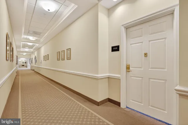 a view of a hallway with white walls