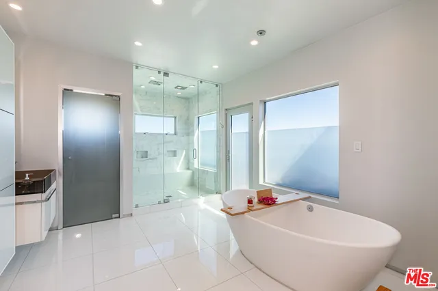 a utility room with sink dryer and washer