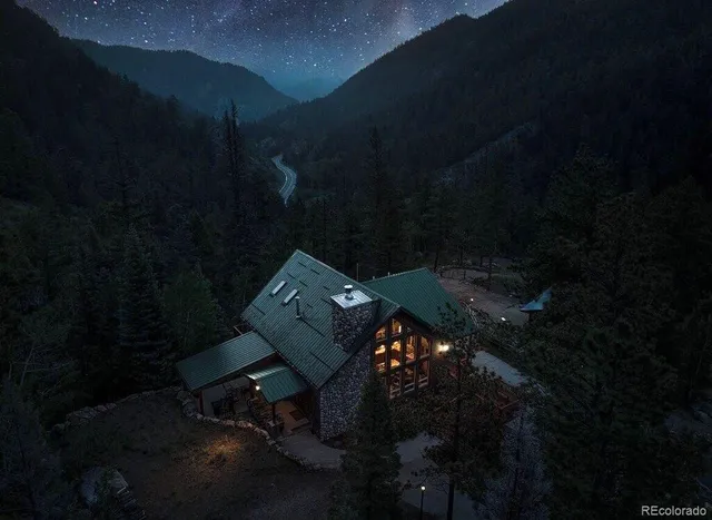 a view of a backyard with sitting area