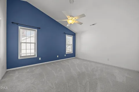a bathroom with a granite countertop sink a mirror and a shower