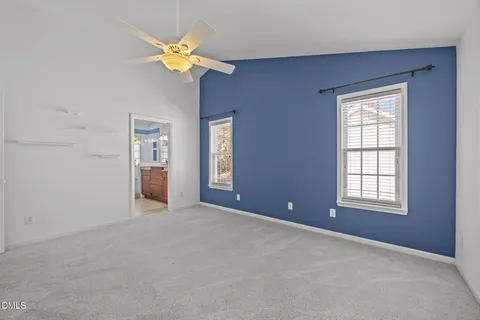 a bathroom with a granite countertop sink a large mirror and a vanity