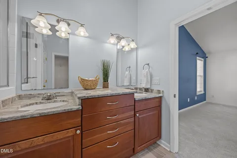 an empty room with a window and a ceiling fan