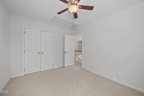 a bathroom with a granite countertop sink a toilet a mirror a bathtub and shower