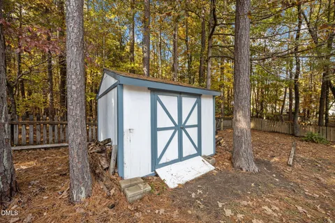 a view of a road with a house in the background
