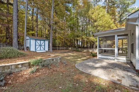 a view of a park with large trees
