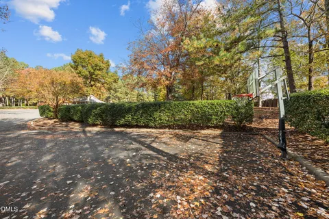 an aerial view of a house with outdoor space