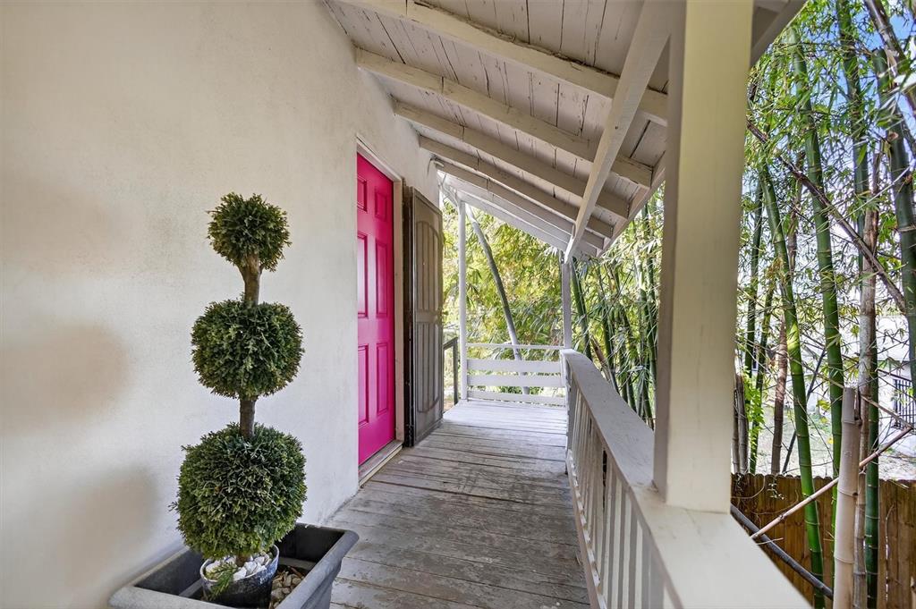 917 Mack Avenue, Unit 2 Orlando, FL 32805 - Photo 3 of 19 a vase of flowers sitting on a floor in front of a house