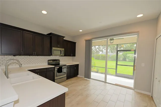 a large bathroom with a double vanity sink and mirror