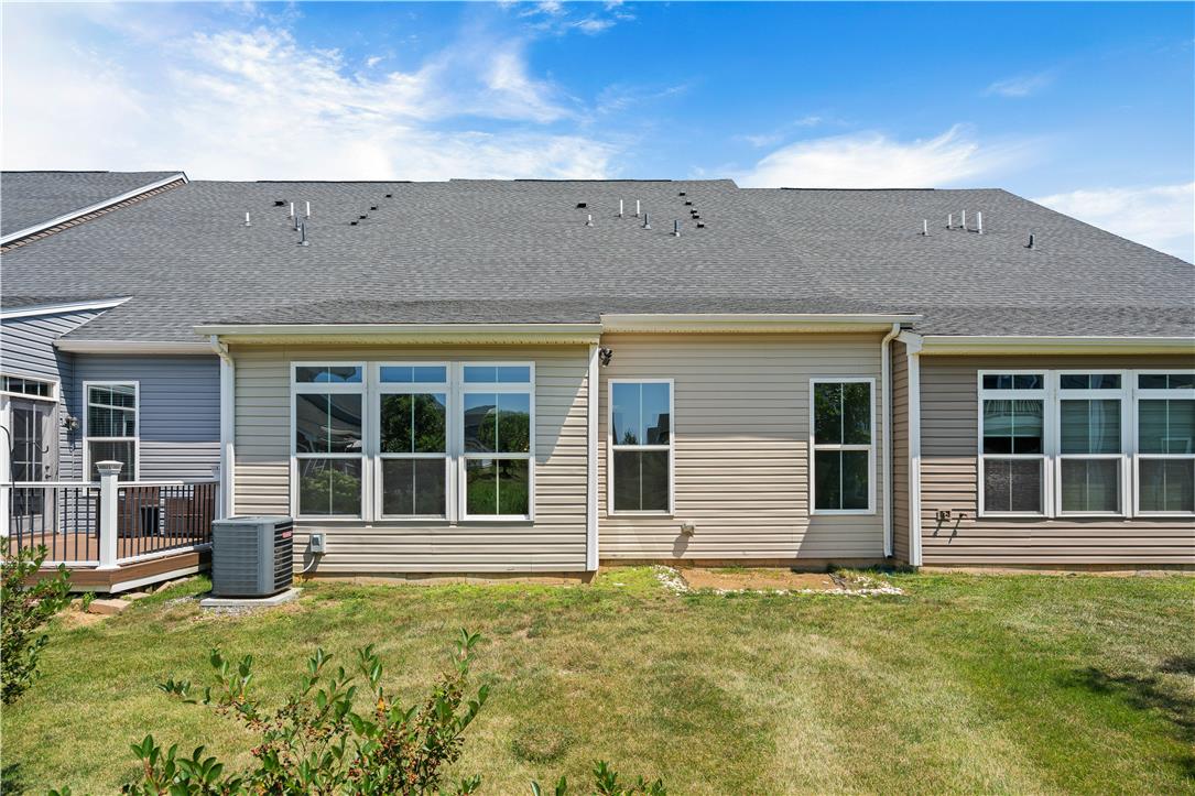 4758 Rafi Road Easton, PA 18045 - Photo 52 of 55 A neatly maintained backyard with a private deck, offering a seamless extension of indoor living to the outdoors.