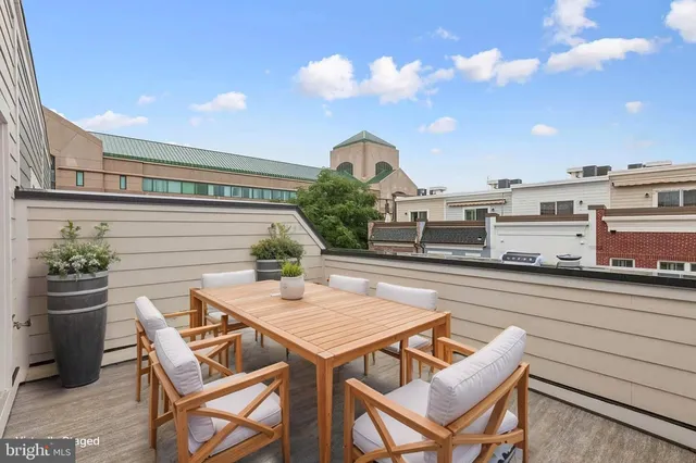 a view of a chairs and table in the patio