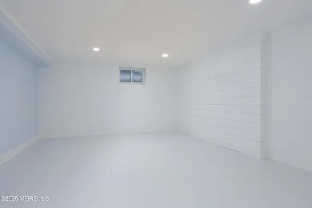 a front view of a house with a yard and a garage